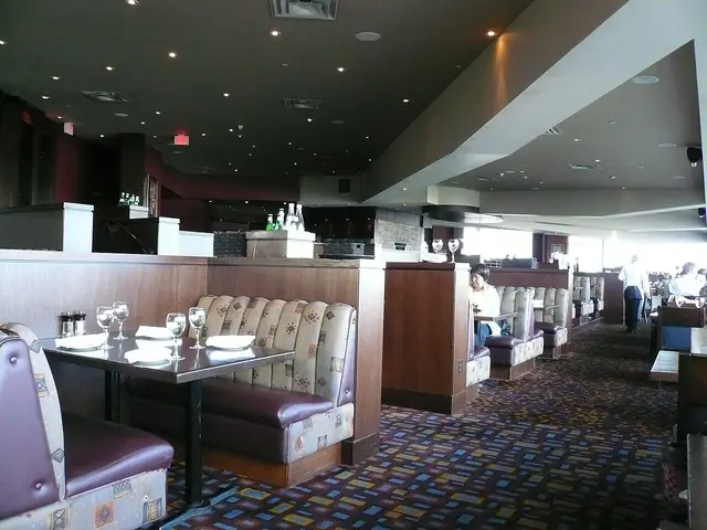 Restaurant seating area at a Keg Steakhouse in Niagara Falls, Ontario, with tables set for dining.
