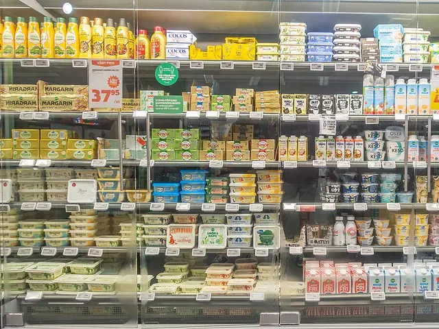 Refrigerated shelves stocked with milk, butter and other dairy products in a Swedish grocery store