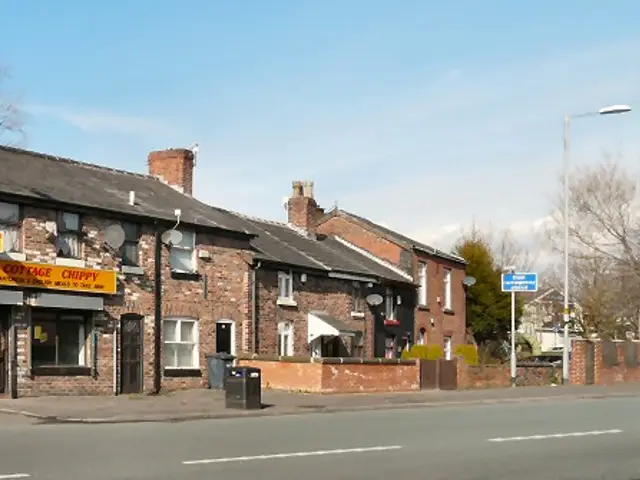 Exterior of a small cottage-style chip shop.