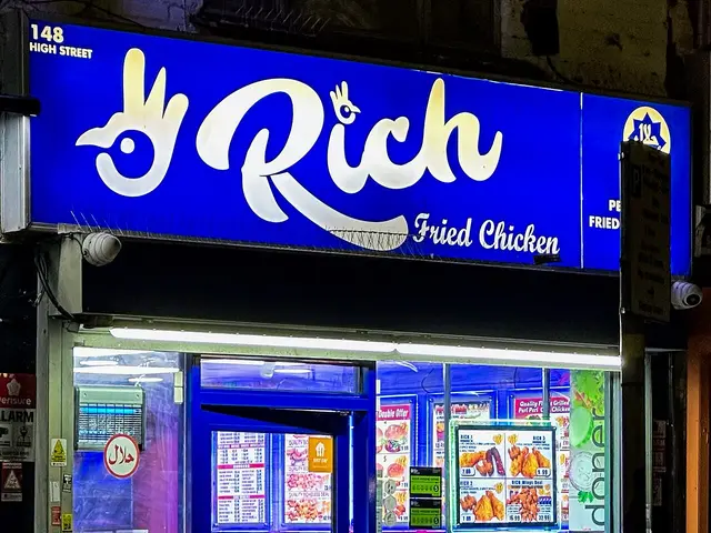 Shopfront of an independent fried chicken takeaway shop.