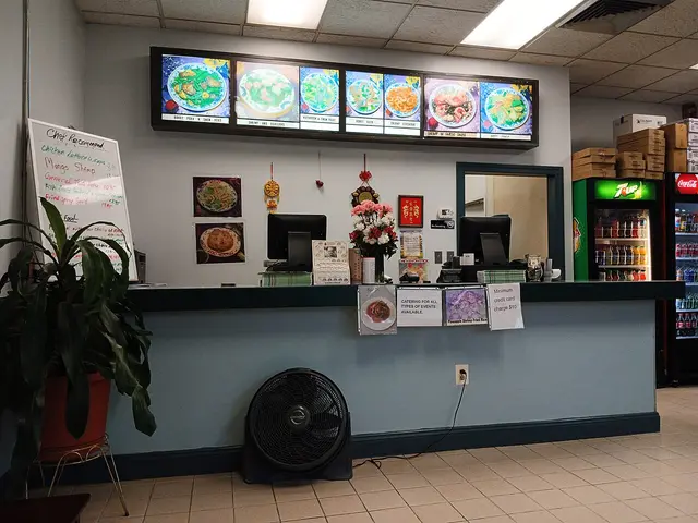 The interior dining area of a Chinese restaurant.