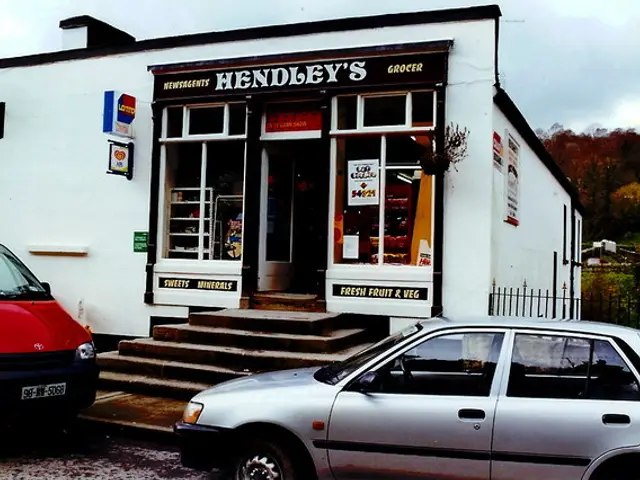 The whitewashed storefront of Hendley's grocery shop in Avoca, Ireland, advertising fresh fruit and veg