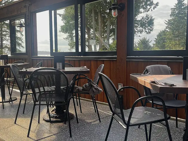 Interior dining area of Browns Social House restaurant in Tofino, Canada, with tables and chairs.