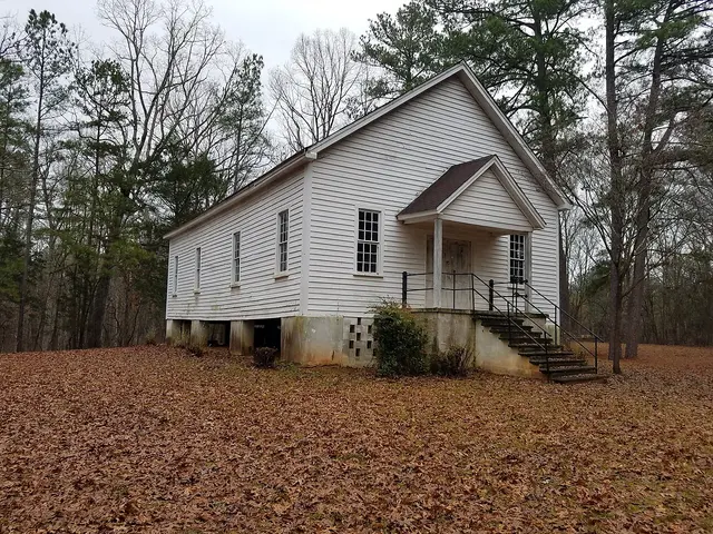 Exterior of the Liberty Universalist Church, a white wooden church building built in 1831.
