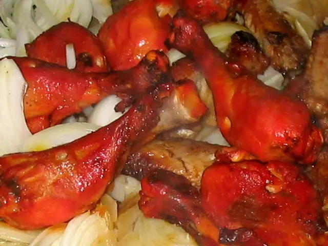 A plate of tandoori chicken, an Indian dish of chicken marinated and roasted in a clay oven.