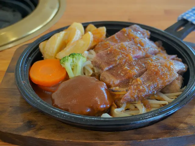 A beef and hamburg steak plate served at a restaurant.