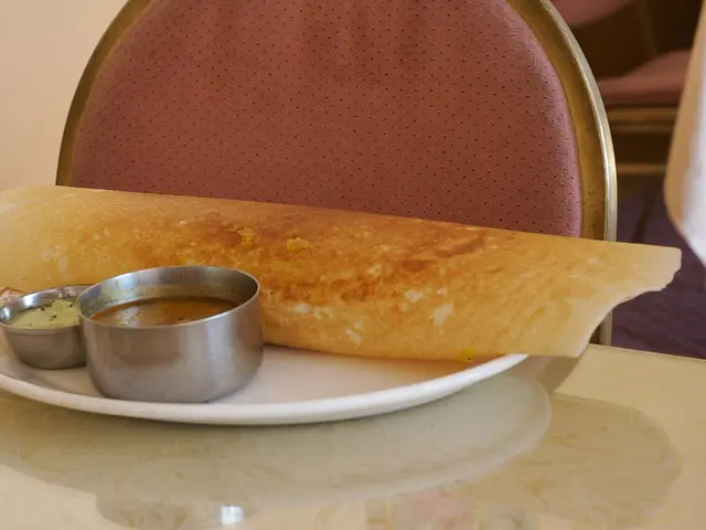 A South Indian dosa served with coconut chutney and sambar.