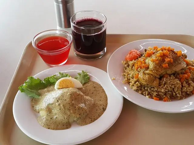 A Peruvian lunch of chicken with rice and ocopa sauce.