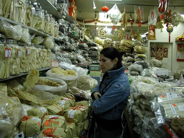 Storefront of a market with produce displayed outside in Toronto's Chinatown district.