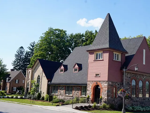 The stone and shingled exterior of Walkerton Baptist Church in Walkerton, Ontario