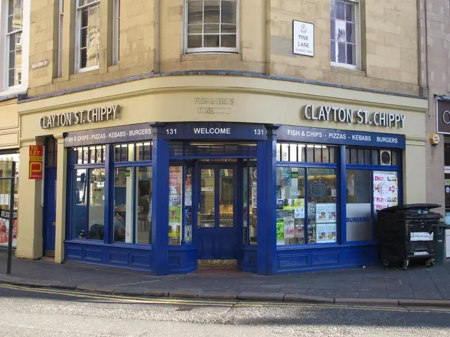 Shopfront of a street-corner fish and chip shop.